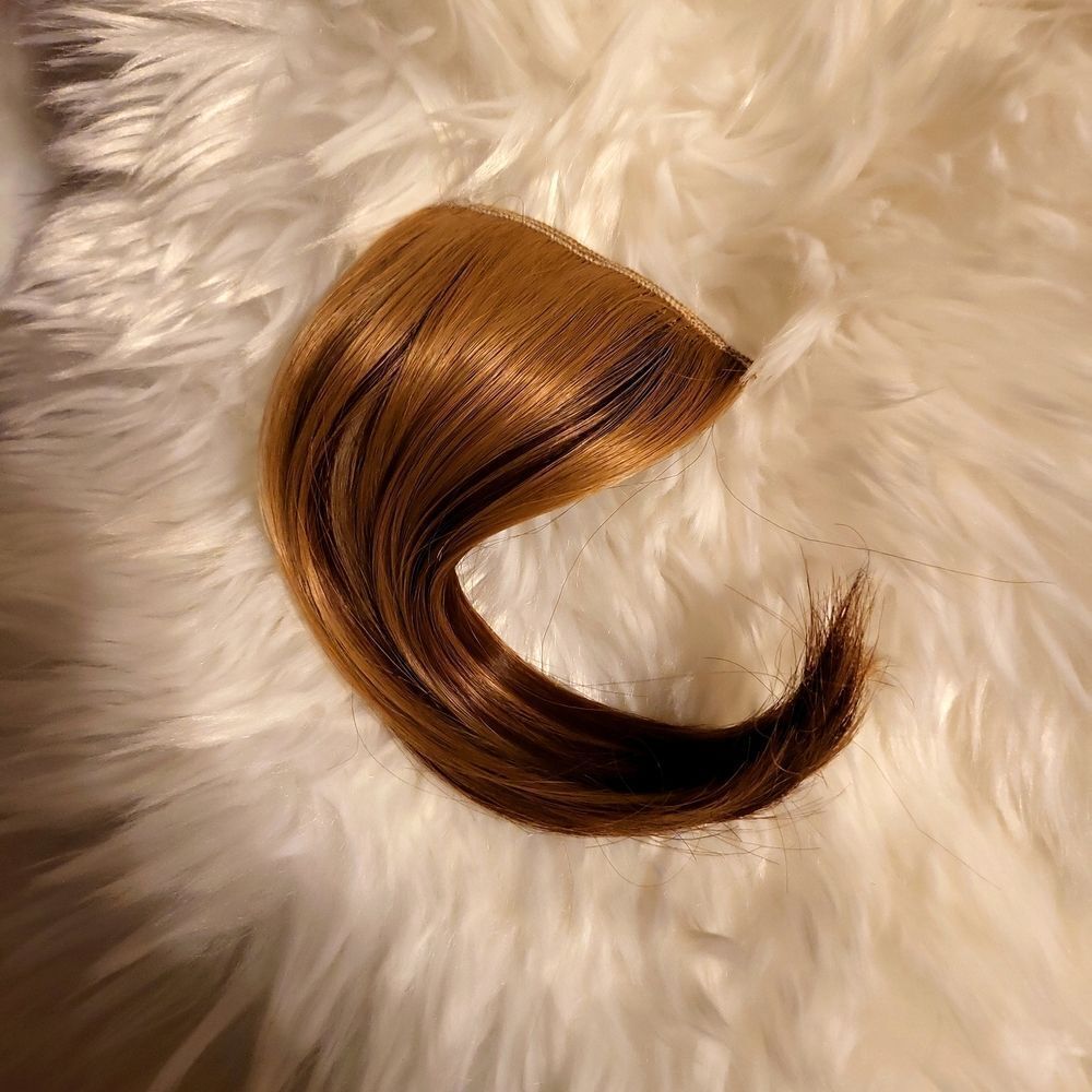 Real human hair , bangs, or can be used as a hair piece, dirty blonde color,